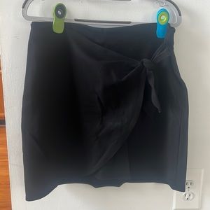 Loft pull on skirt. Black, stretchy with tie knot detail